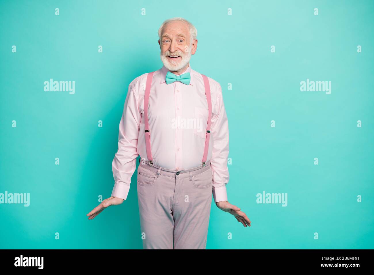 I'm ready. Photo of funny grandpa good mood listen cool news black friday  season addicted shopper wear pink shirt suspenders bow tie pants isolated  Stock Photo - Alamy