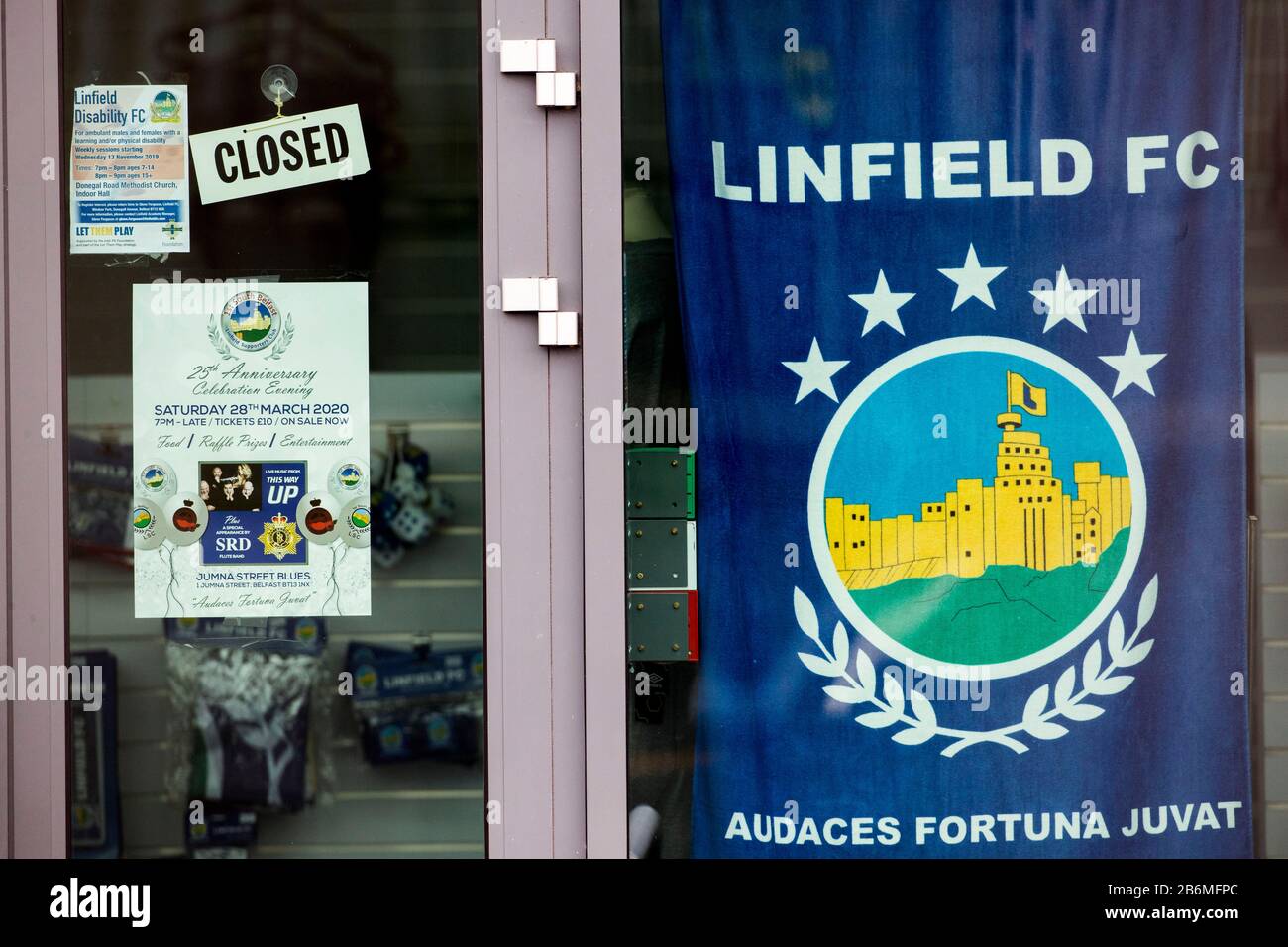 The closed Linfield FC superstore at the National Football Stadium at Windsor Park in Belfast. The stadium, which is the home of Linfield FC and Northern Ireland's national football team, has closed its offices and superstore for a deep clean after a Linfield player contracted Coronavirus. Stock Photo
