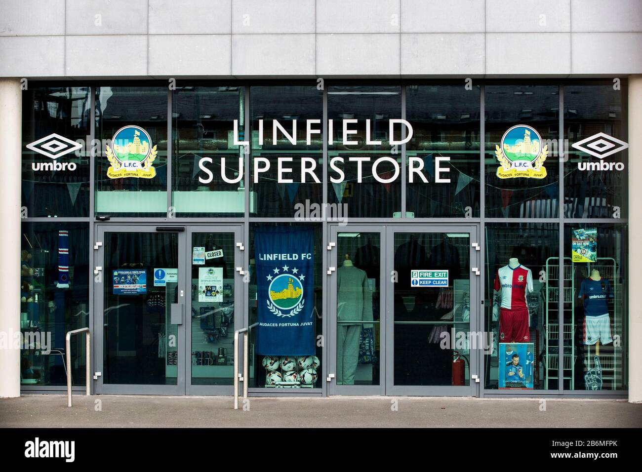 The closed Linfield FC superstore at the National Football Stadium at Windsor Park in Belfast. The stadium, which is the home of Linfield FC and Northern Ireland's national football team, has closed its offices and superstore for a deep clean after a Linfield player contracted Coronavirus. Stock Photo