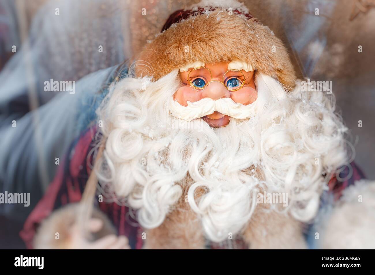 Santa Claus doll in window Stock Photo