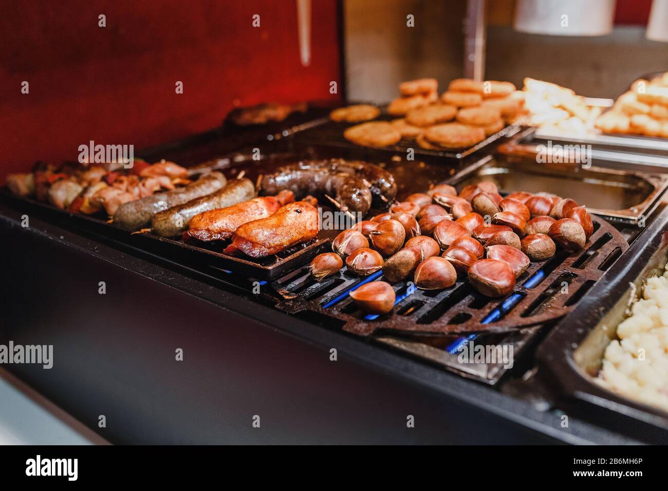 Street Food at market a water chestnut and sausages Stock Photo