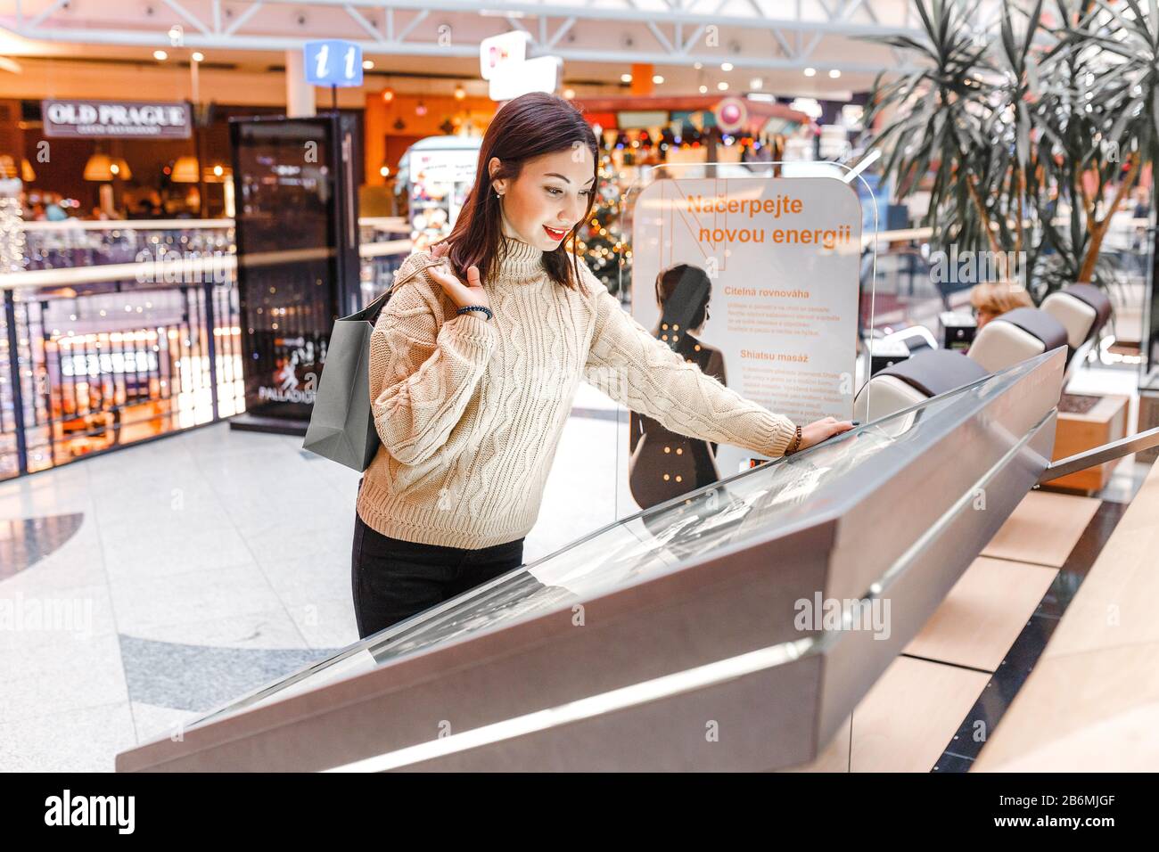 DECEMBER 2017, PALLADIUM MALL, PRAGUE, CZECH REPUBLIC: Young woman looking  at information map in a shopping mall Stock Photo - Alamy