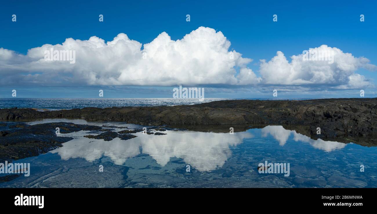 View of cloud reflected in sea, Pacific Ocean, Pu uhonuna O Honaunau National Park, South Kona, Hawaii, USA Stock Photo