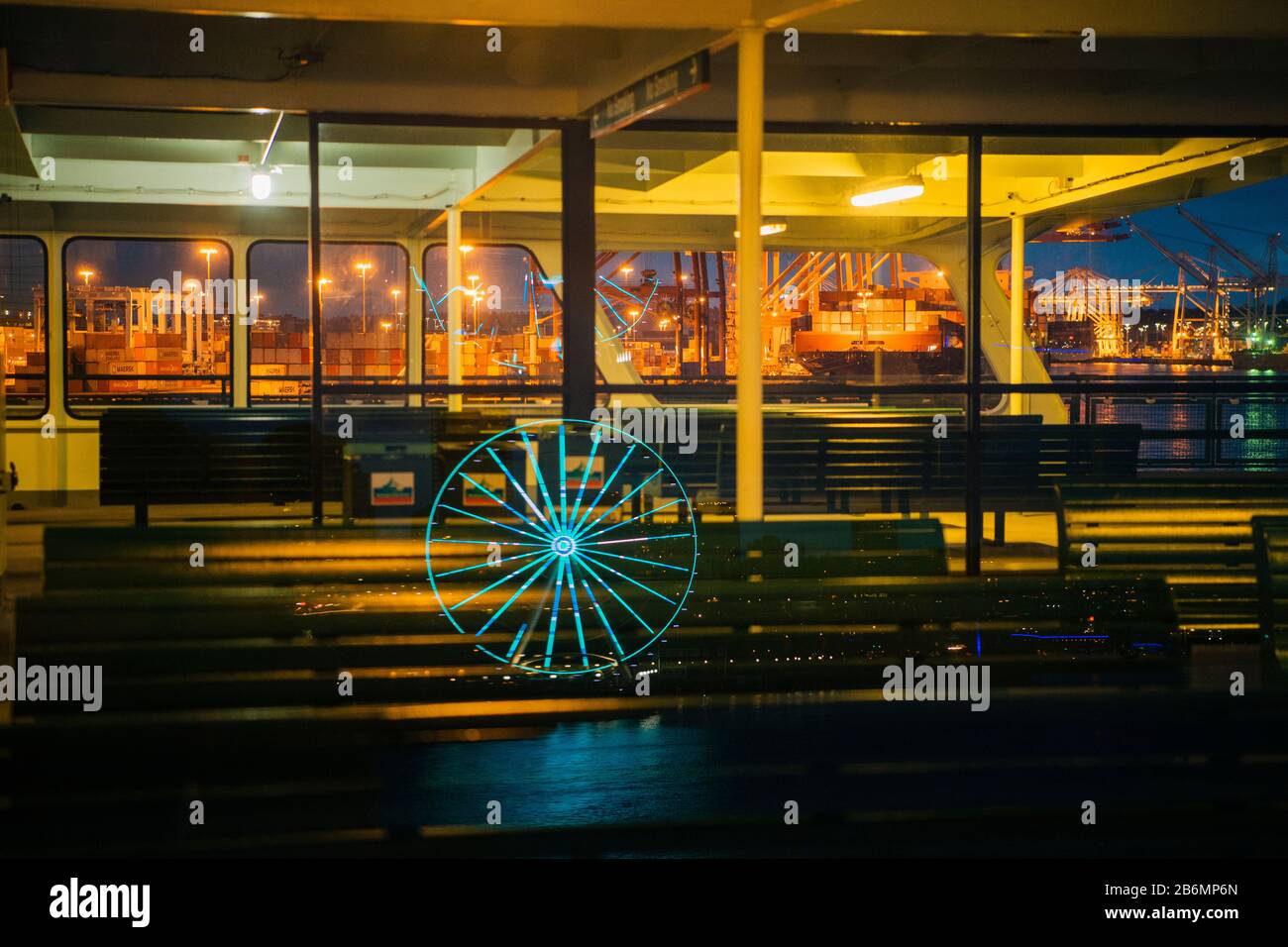 View of ferris wheal reflection in city by night, Seattle, Washington, USA Stock Photo