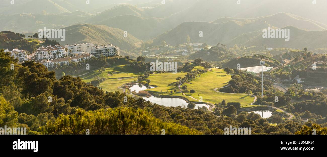 Eighteen holes Golf course, Alhaurin Golf Resort, next to apartment blocks, Malaga, Spain. Stock Photo