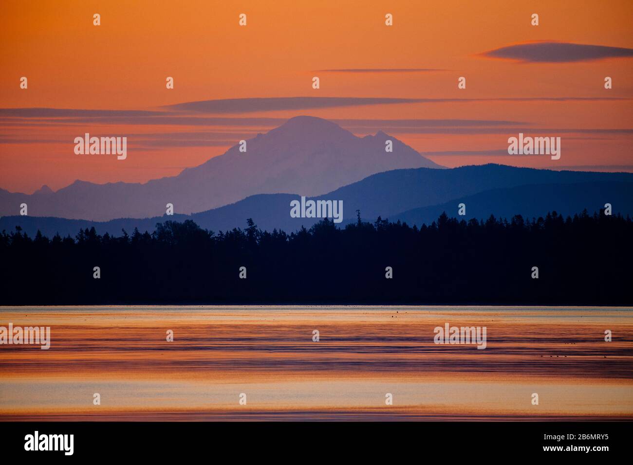 Strait of Juan de Fuca and Mount Baker silhouetted at sunset, Washington State, USA Stock Photo
