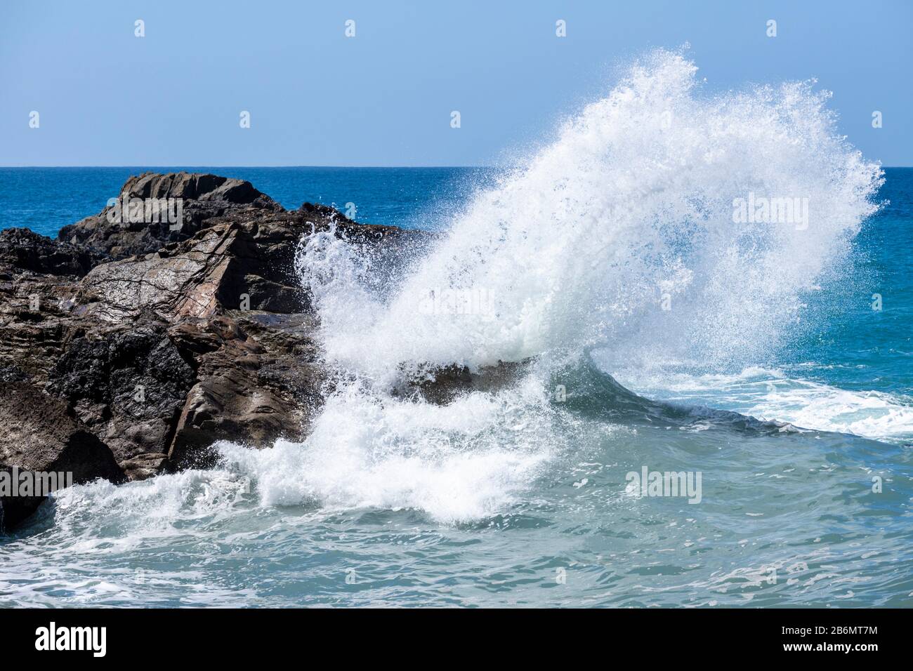 Heavy Atlantic seas with large waves crashing onto rocks on the beach at Ajuy on the Canary Island of Fuerteventura Stock Photo