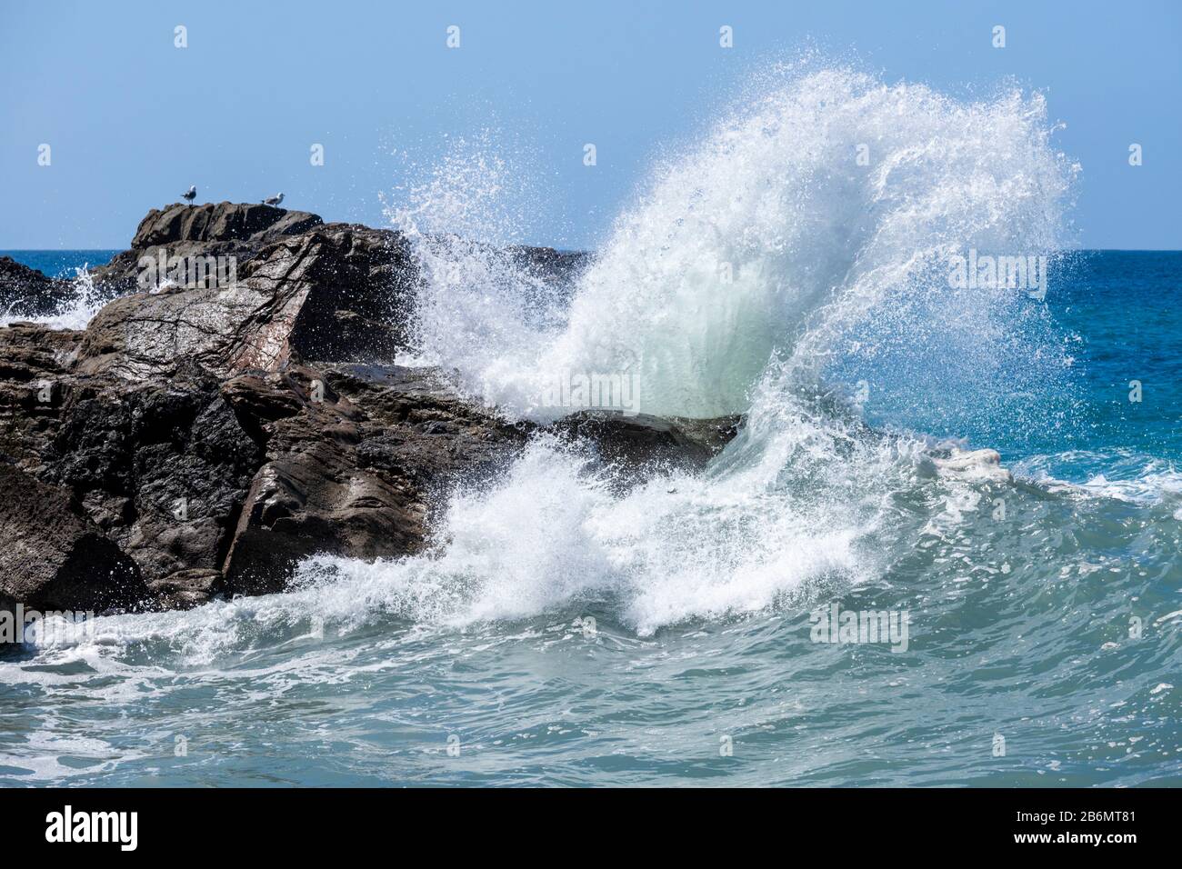 Heavy Atlantic seas with large waves crashing onto rocks on the beach at Ajuy on the Canary Island of Fuerteventura Stock Photo