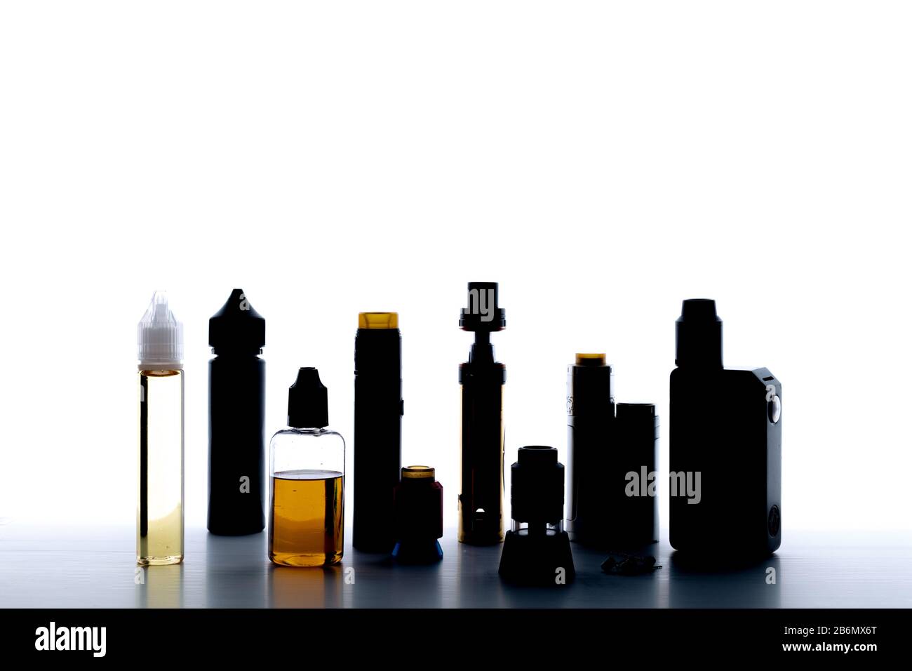 Backlighting picture of diferent electronic cigarette stuff with white background vape vaping machines Stock Photo