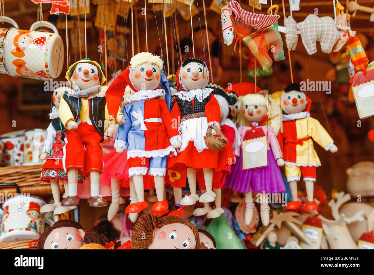 many puppet dolls hang in market stall Stock Photo - Alamy