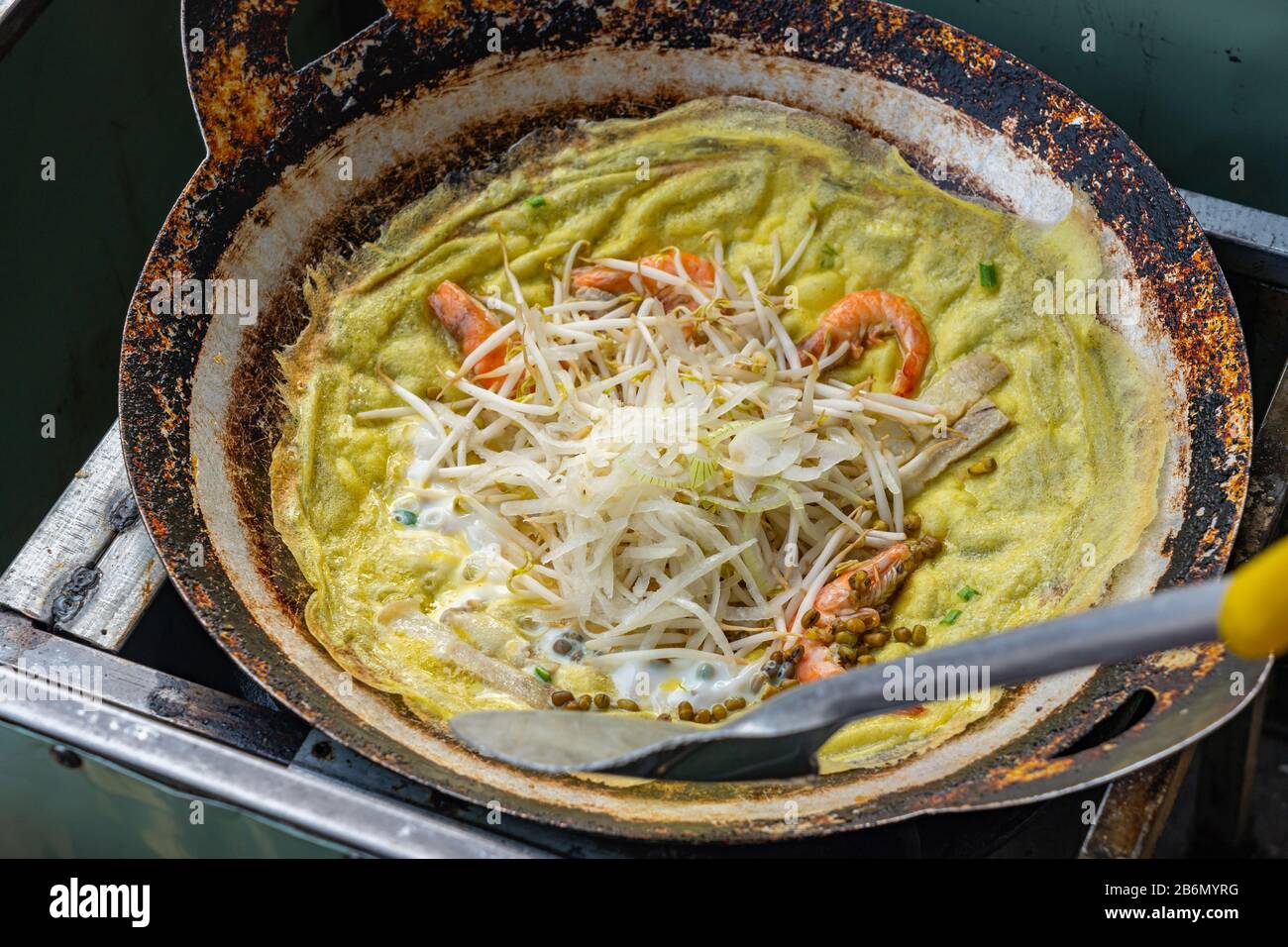 Vietnamese local cuisine shrimp pancake stuffed with bean sprouts