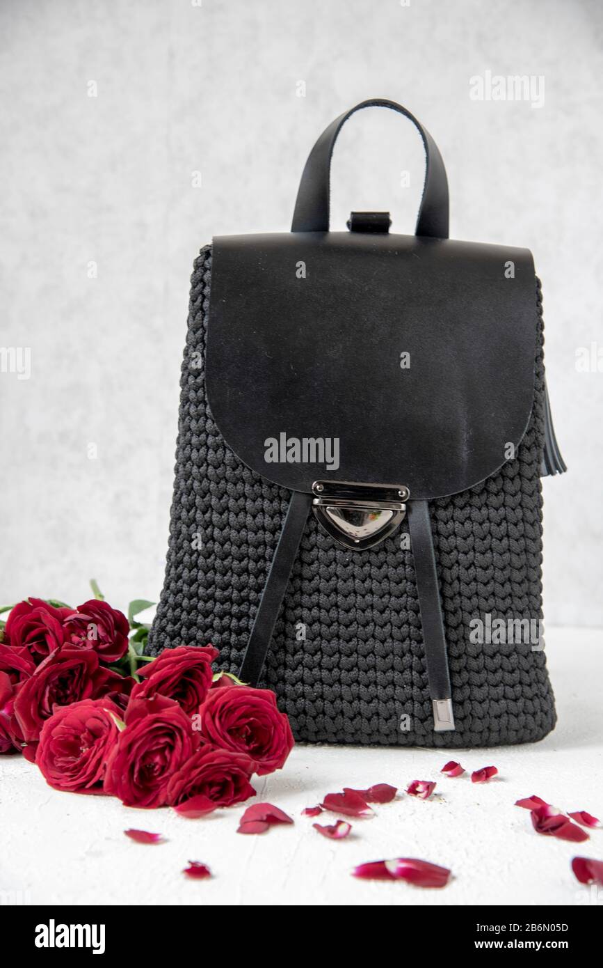 black backpack with roses