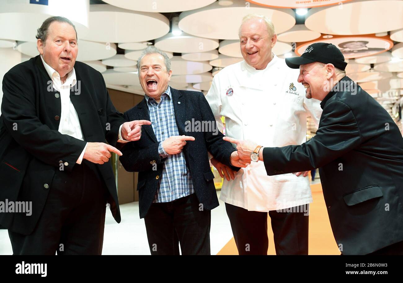 11 March 2020, Bavaria, Munich: Ottfried Fischer (l-r), actor, Günther Sigl, composer and member of the band Spider Murphy Gang, Alfons Schuhbeck, star chef, and Barny Murphy, member of the band Spider Murphy Gang, laugh in the Stachus Passages at the Sky of Fame. At the Sky of Fame, on the ceiling circles of the Stachus Passages, there are pictures of Munich personalities. Photo: Tobias Hase/dpa Stock Photo