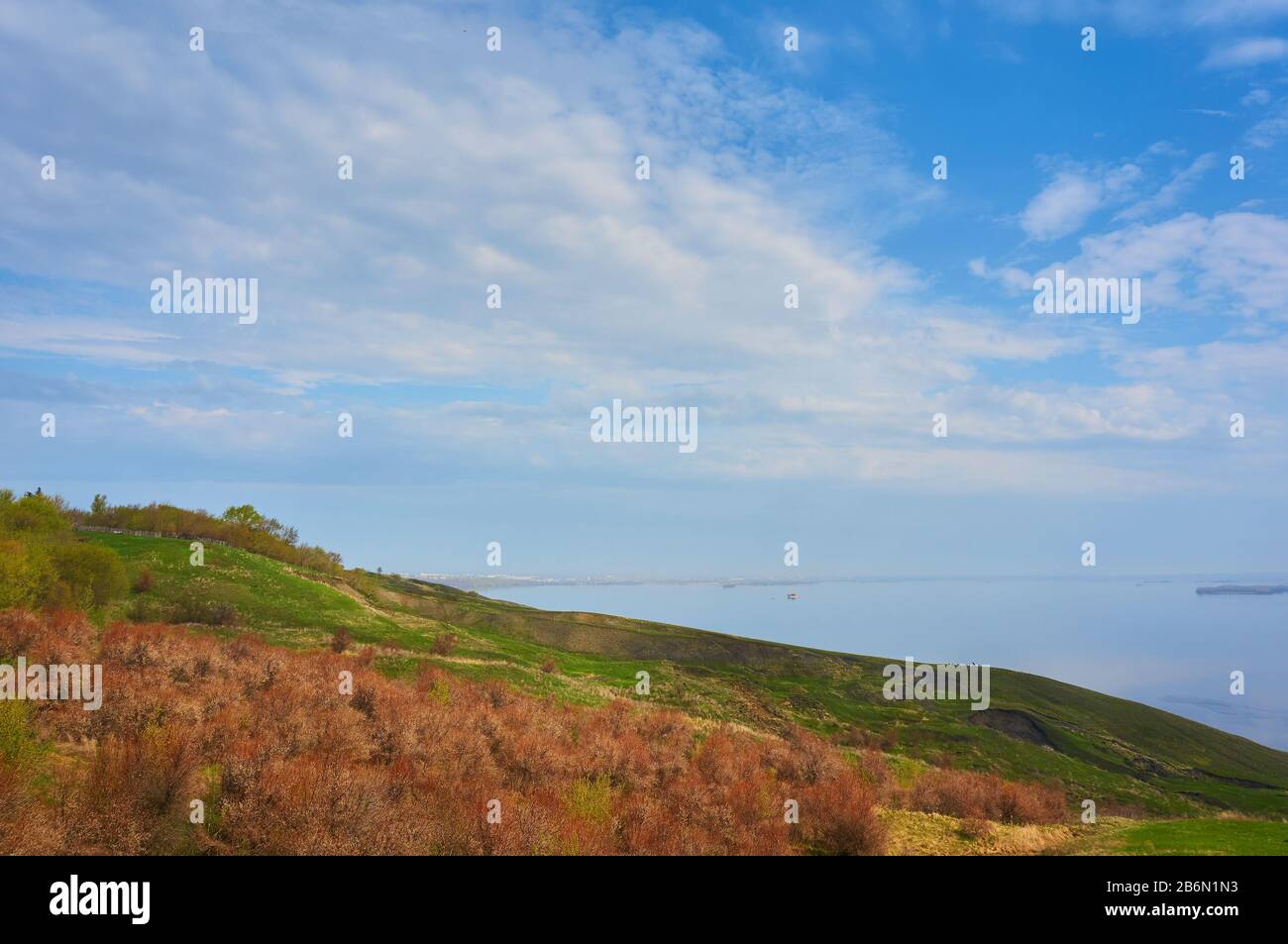 Mountain Beach in the fall against the blue sky with clouds. Stock Photo