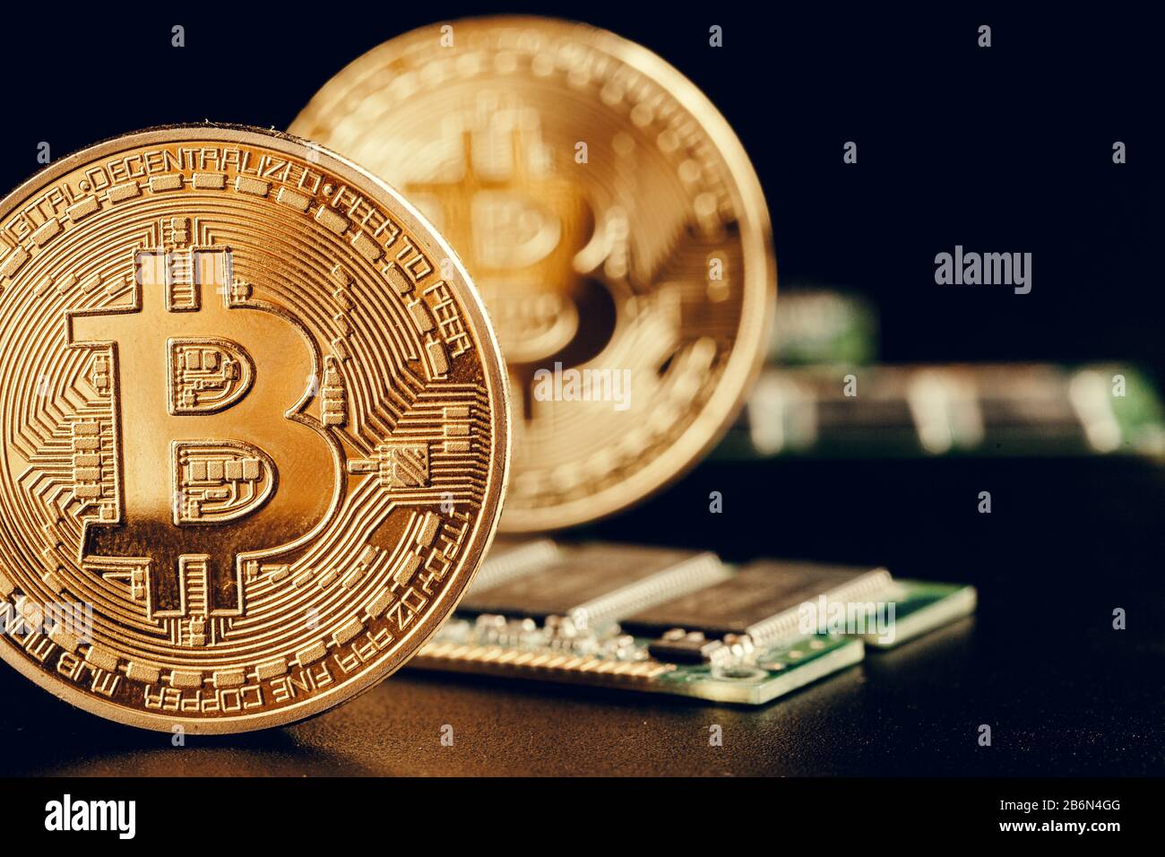 golden bitcoin and computer chip in background creative photo Stock Photo -  Alamy