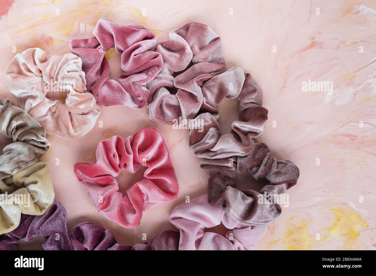 Collection of trendy velvet scrunchies on pink background. Diy accessories  and hairstyles concept, copy space Stock Photo - Alamy