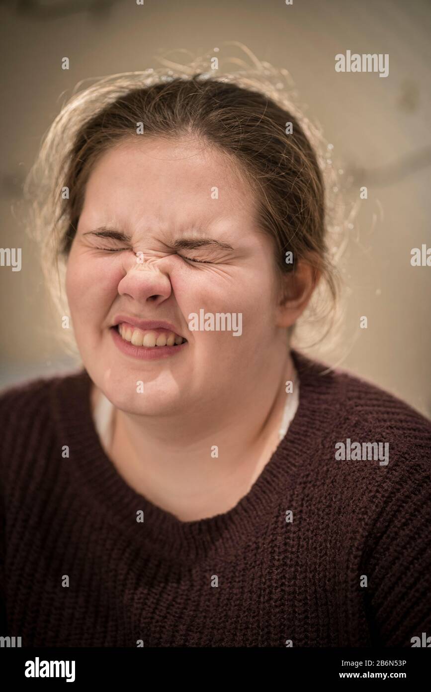 Face only, close up portrait of a 14 year old teenage girl with her eyes closed Stock Photo