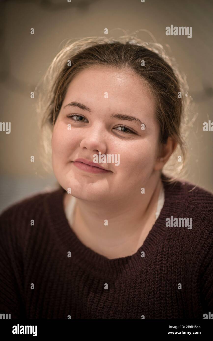 Face only, close up portrait of a smiling 14 year old teenage girl. Stock Photo