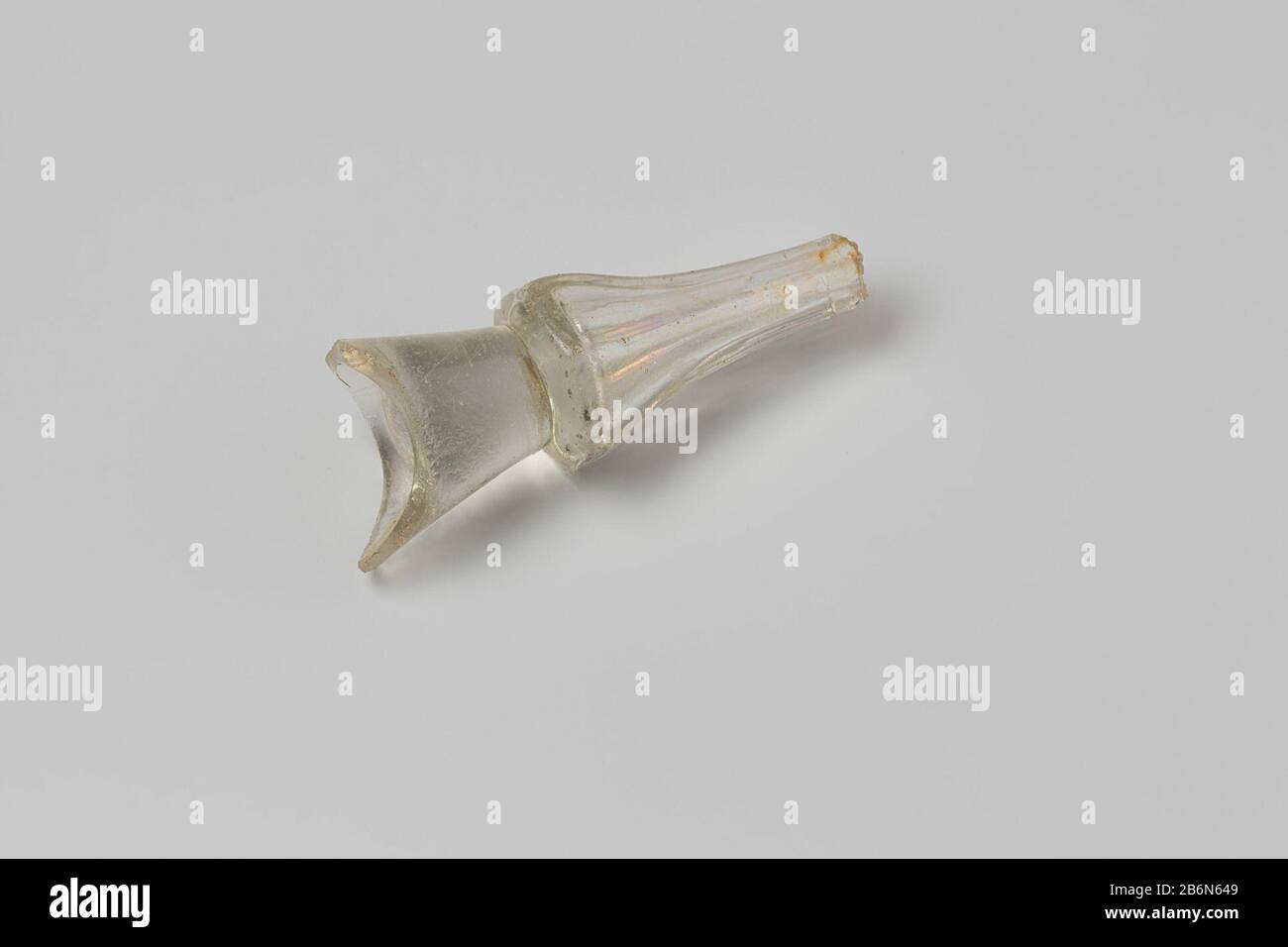 Glass, stem glass, steel, faceted; fragment, hexagonal faceted, tapering downward, hollow core, bevelled upper end with base of bowl, conically everted. Manufacturer : anoniemPlaats manufacture: Nederland Dating: 1700 - in of voor 13-aug-1743 Material: glas  Dimensions: h 6,8 cm.  × d 2,8 cm.  Date: 1743-08-13 - 1743-08-13 Stock Photo