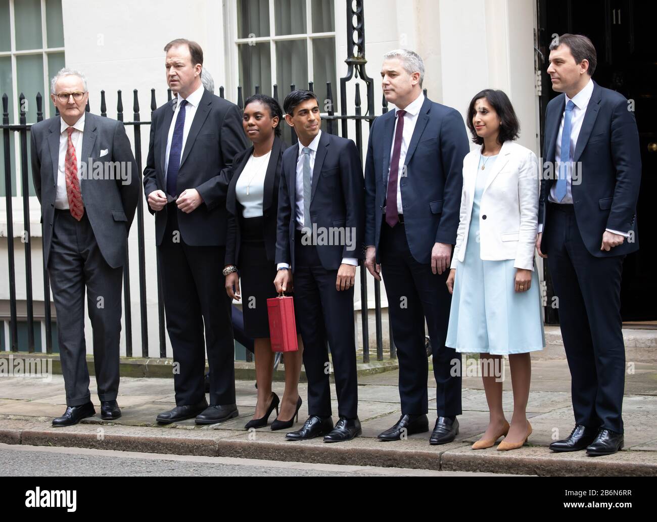 Members of the Treasury pose for photos on Budget Day in Downing Street, London, UK Stock Photo