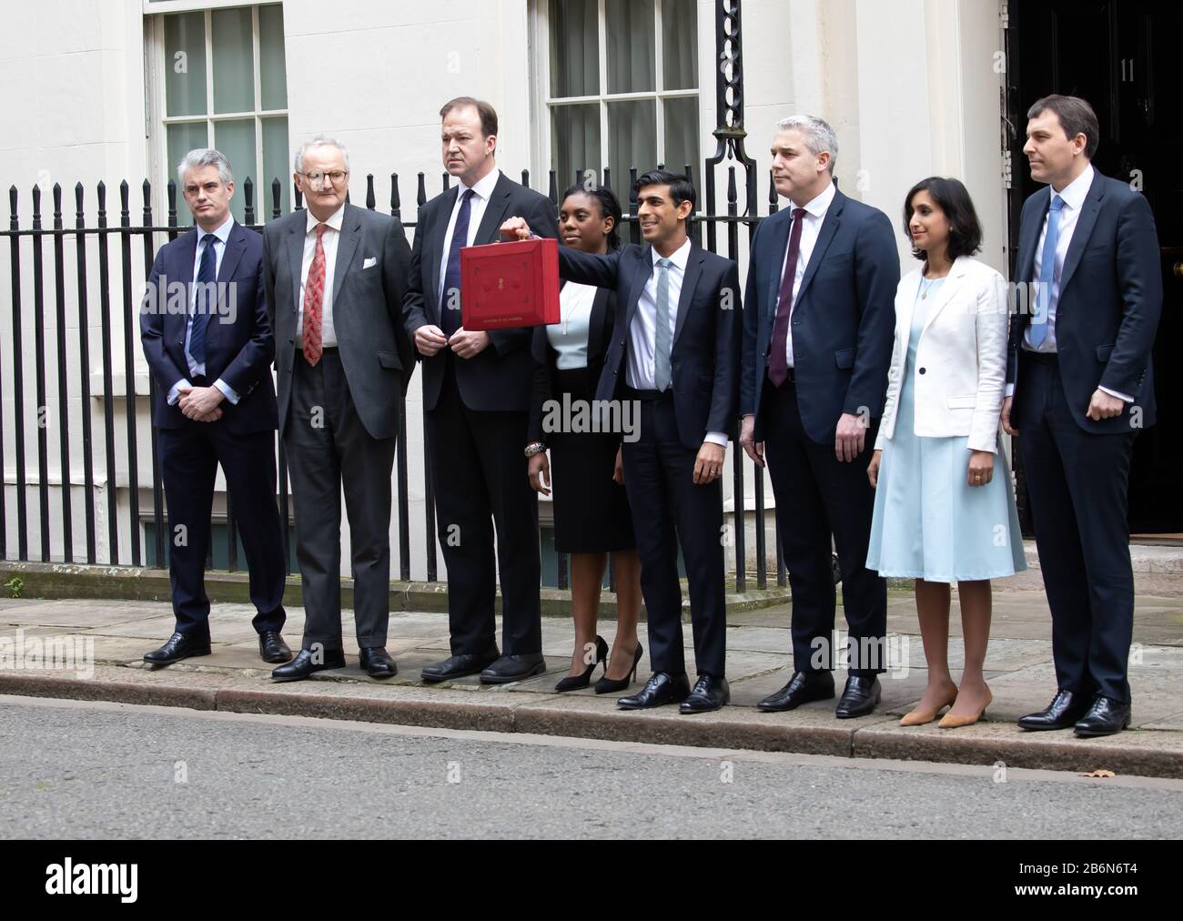 Members of the Treasury pose for photos on Budget Day in Downing Street, London, UK Stock Photo