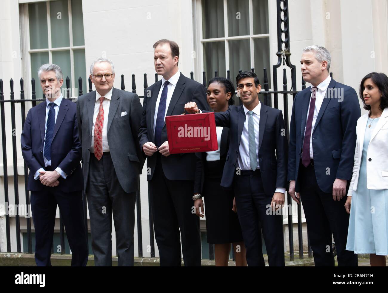 Members of the Treasury pose for photos on Budget Day in Downing Street, London, UK Stock Photo