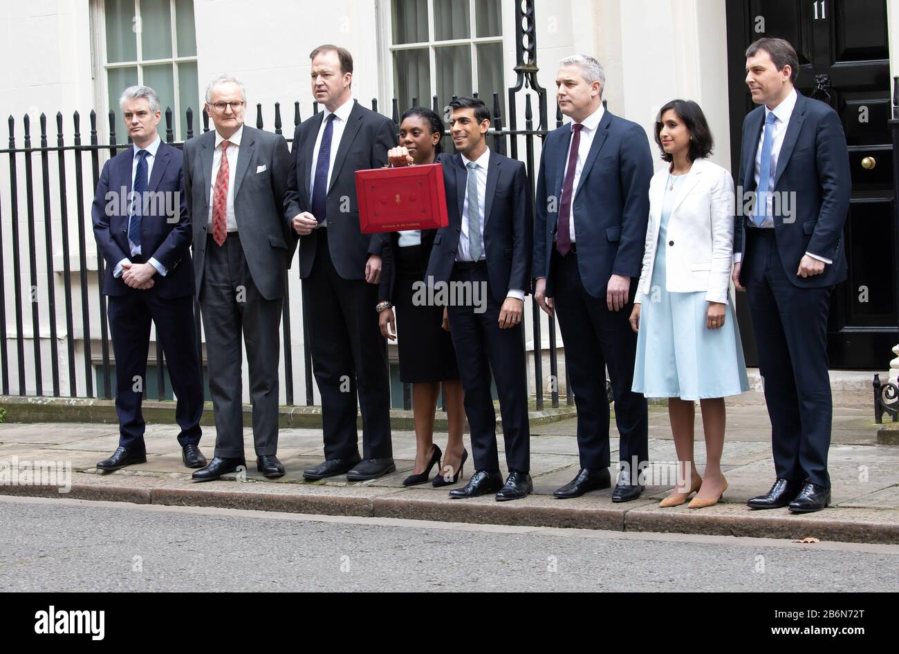 Members of the Treasury pose for photos on Budget Day in Downing Street, London, UK Stock Photo