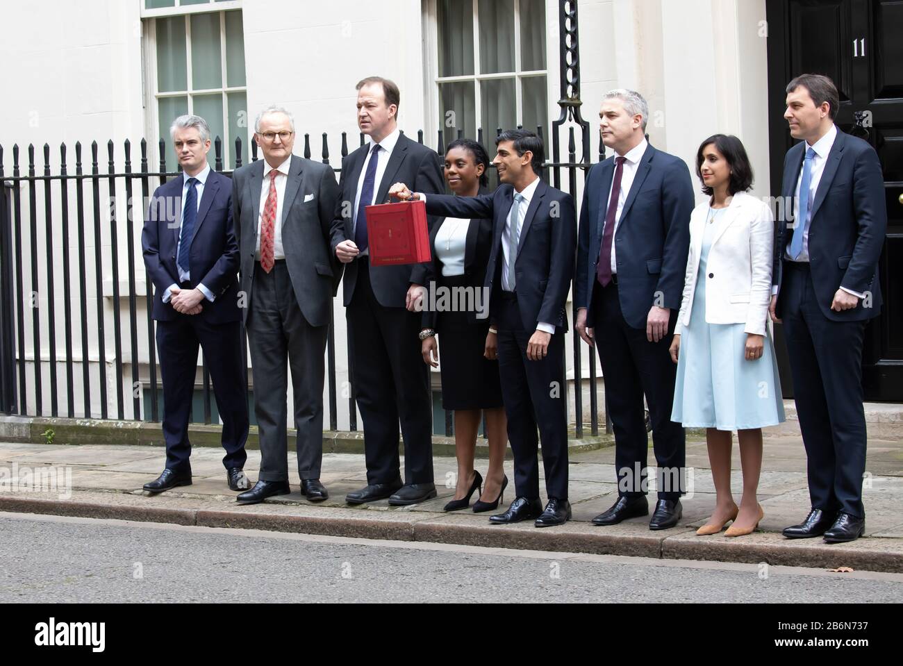 Members of the Treasury pose for photos on Budget Day in Downing Street, London, UK Stock Photo