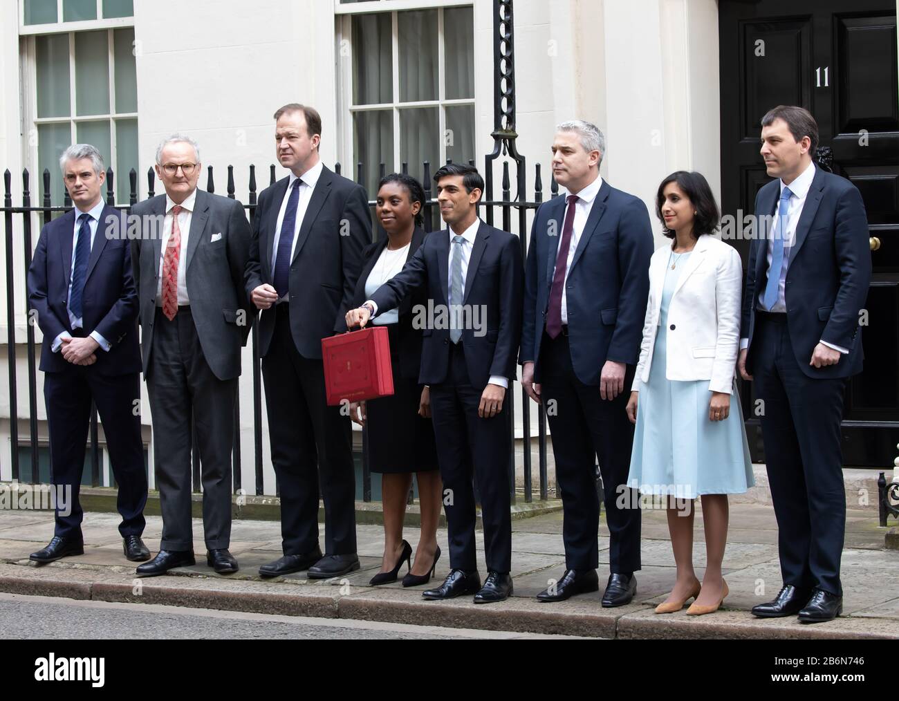 Members of the Treasury pose for photos on Budget Day in Downing Street, London, UK Stock Photo