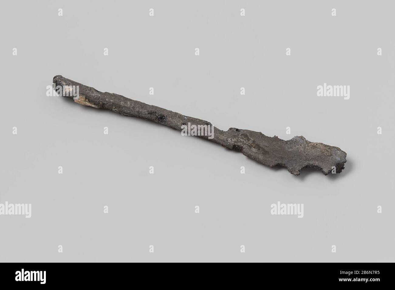Cutlery, fragment: stem of fork or spoon; fragm, heavily corroded, id. NG 1980-27H67. Manufacturer : anoniemPlaats manufacture: Nederland Dating: 1700 - in of voor 13-aug-1743 Material: tin  Dimensions: l 11,9 cm.  × b 2 cm.  × d 0,4 cm.  Date: 1743-08-13 - 1743-08-13 Stock Photo
