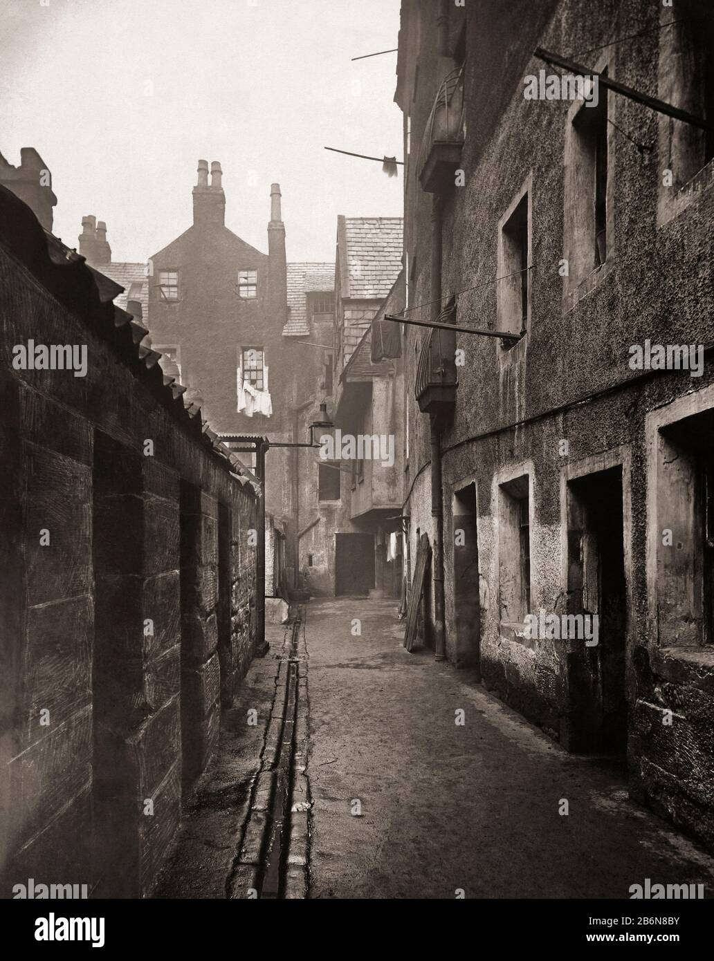 Close, 115 High Street, Glasgow, Scotland in the 1870’s. Photograph from The Old Closes and Streets of Glasgow, by Scottish photographer Thomas Annan 1829-1887. Stock Photo
