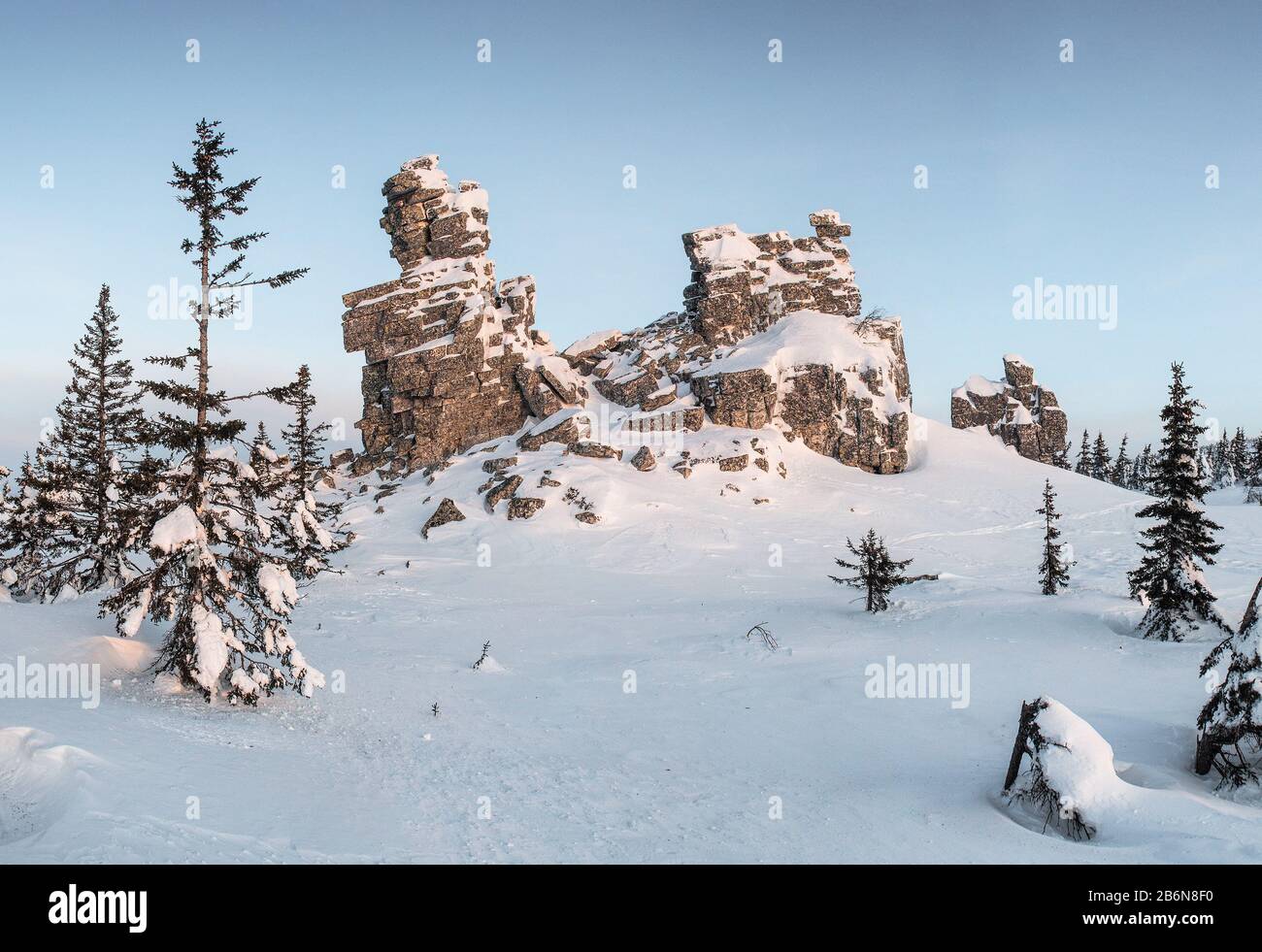 Cliffstone in winter mountains at sunrise Stock Photo