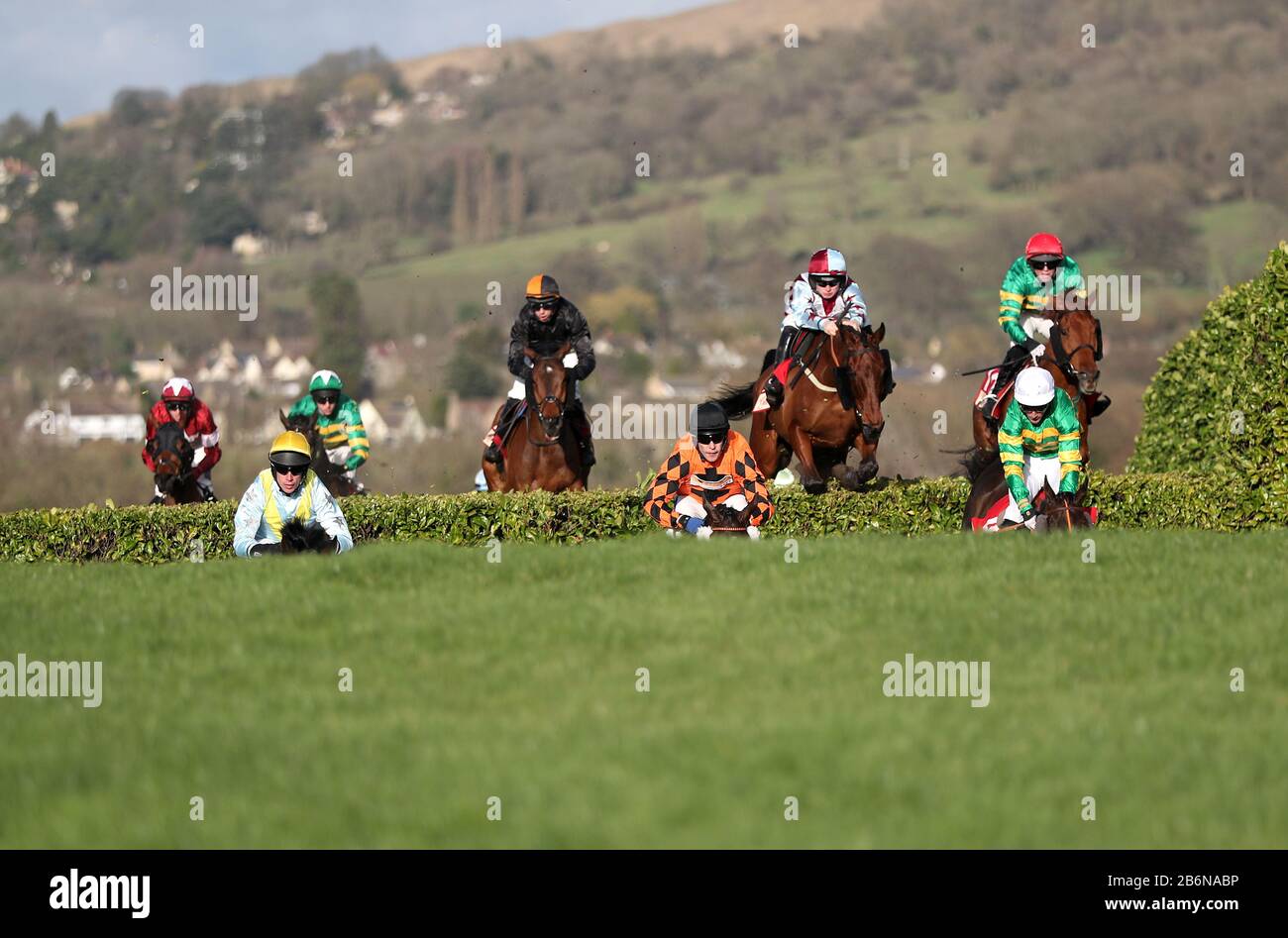 Riders during the Glenfarclas Chase during day two of the Cheltenham Festival at Cheltenham Racecourse. Stock Photo