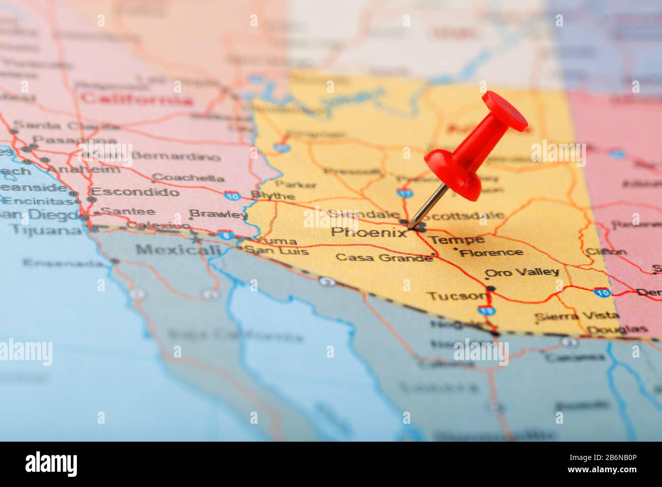 Red clerical needle on a map of the USA, Arizona and the capital Phoenix. Close up map of