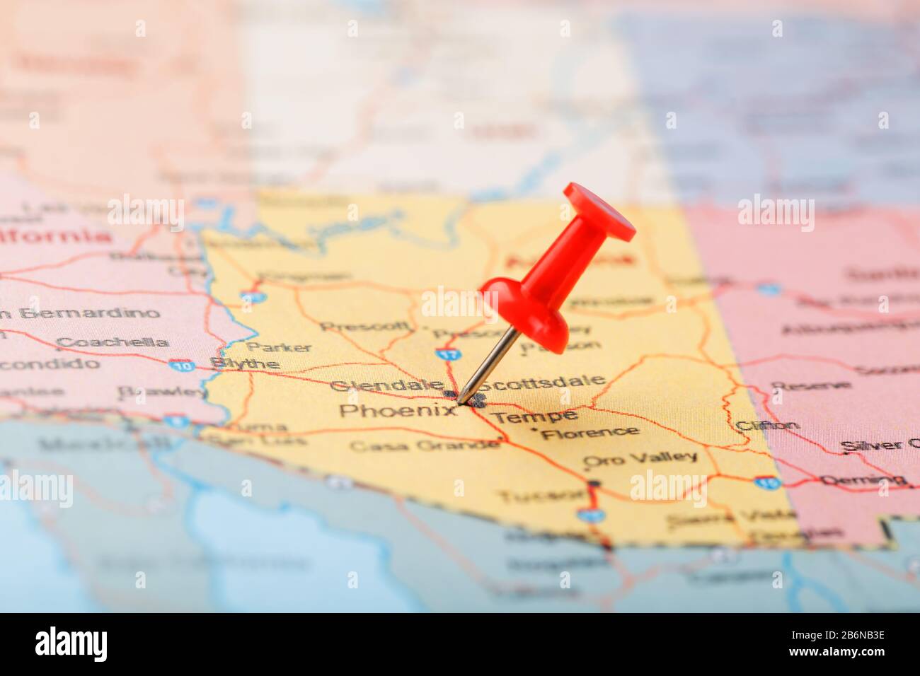 Red clerical needle on a map of the USA, Arizona and the capital Phoenix. Close up map of
