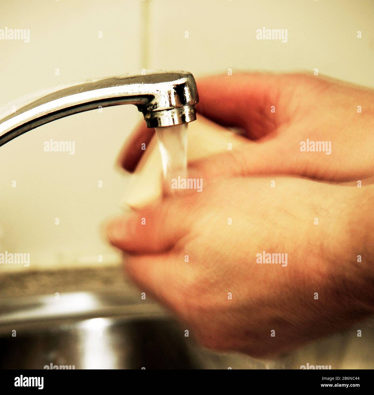 Effective hand washing with soap and water to help stop spread of coronavirus Stock Photo