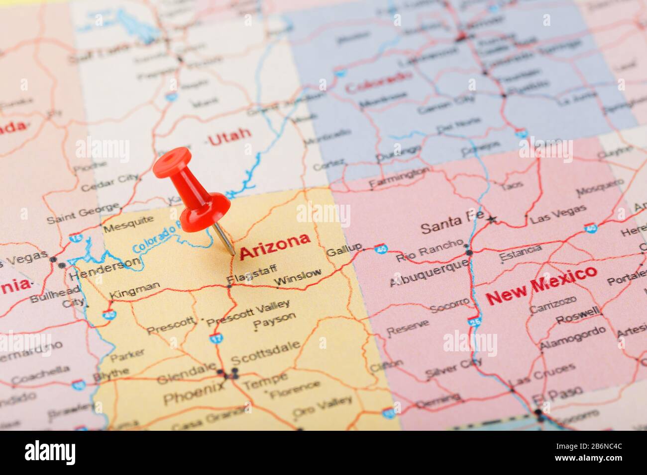 Red clerical needle on a map of USA, Arizona and the capital Phoenix. Closeup Map Arizona with