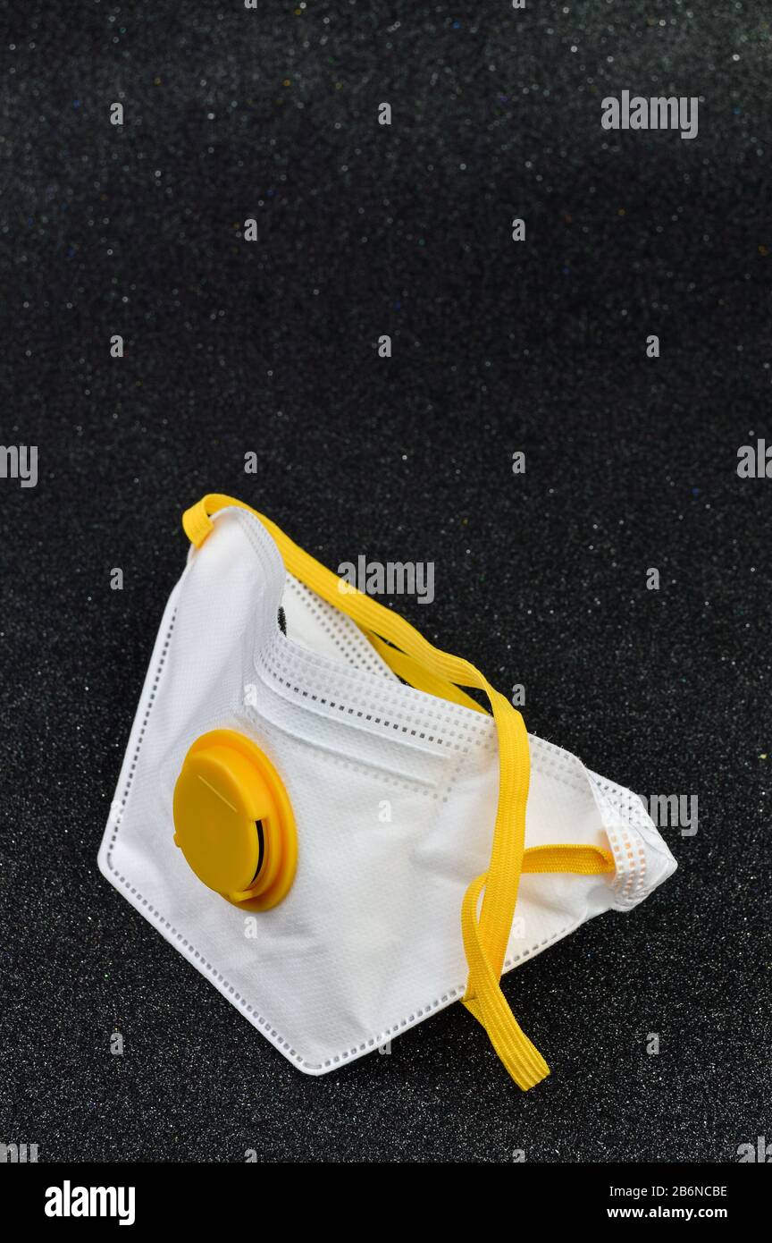 White mask for virus protection on black background Stock Photo - Alamy