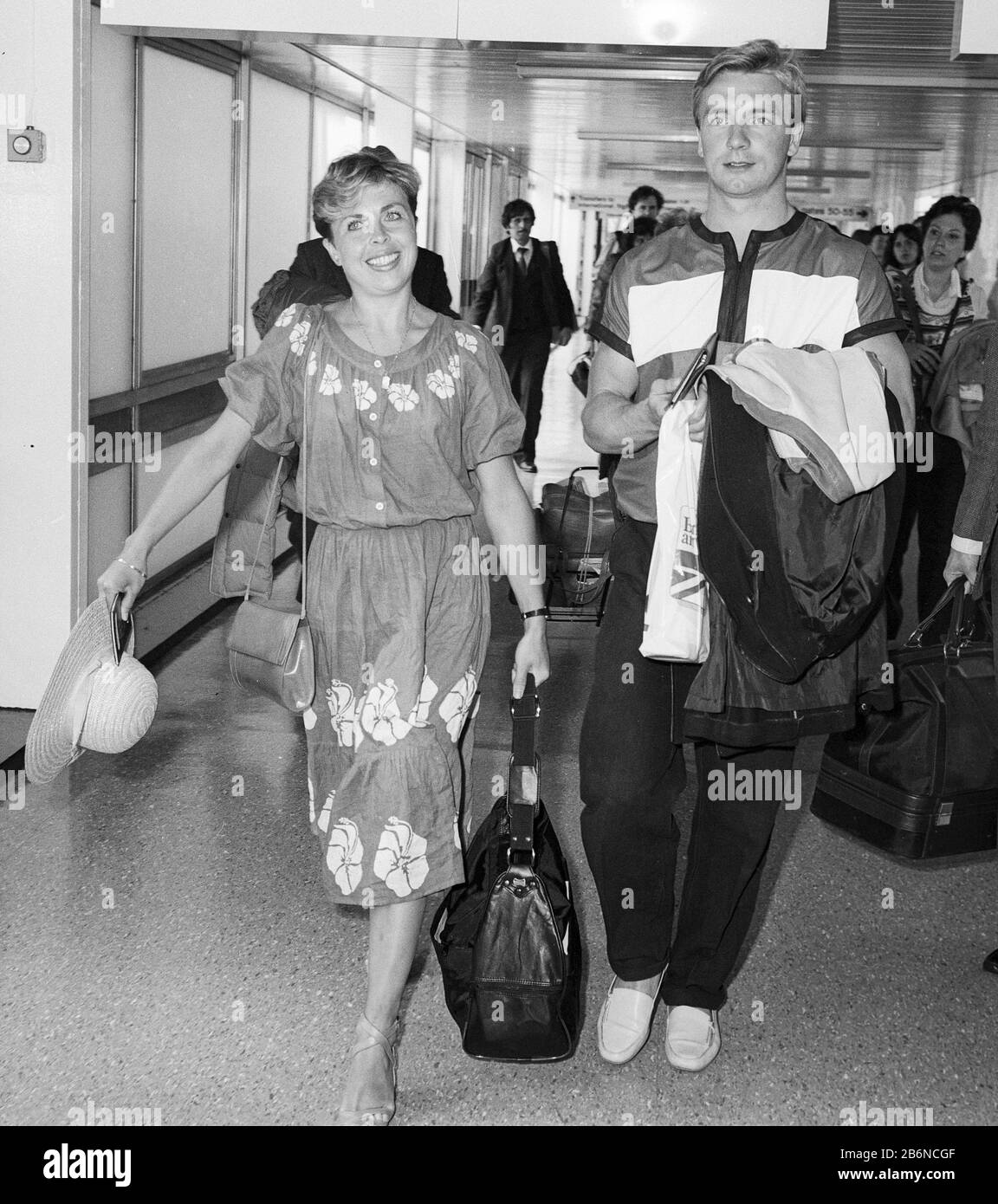 Ice skating champions Jayne Torvill and Christopher Dean arriving at London's Heathrow Airport