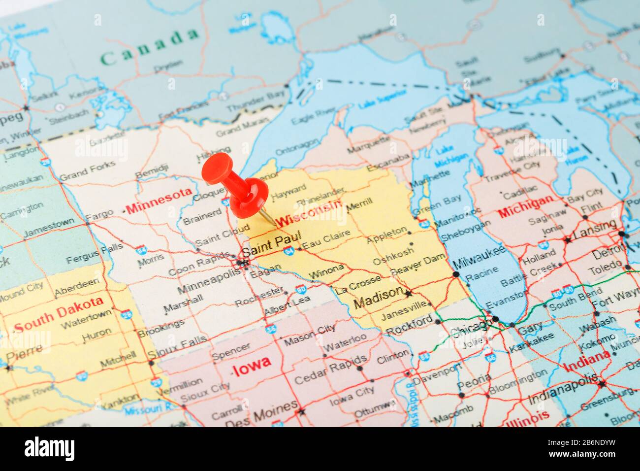 Red clerical needle on a map of USA, Wisconsin and the capital Madison ...