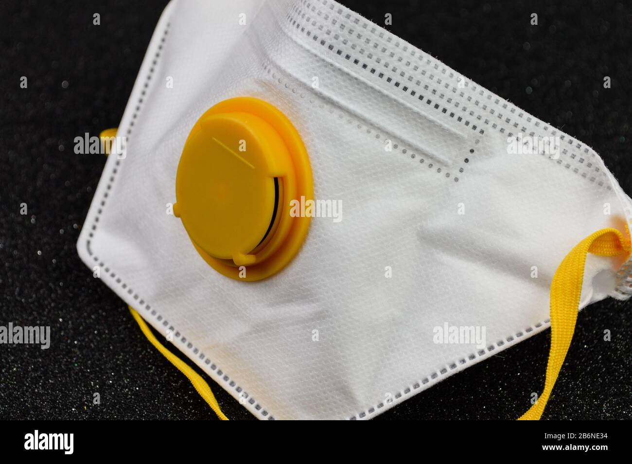 White mask for virus protection on black background Stock Photo - Alamy