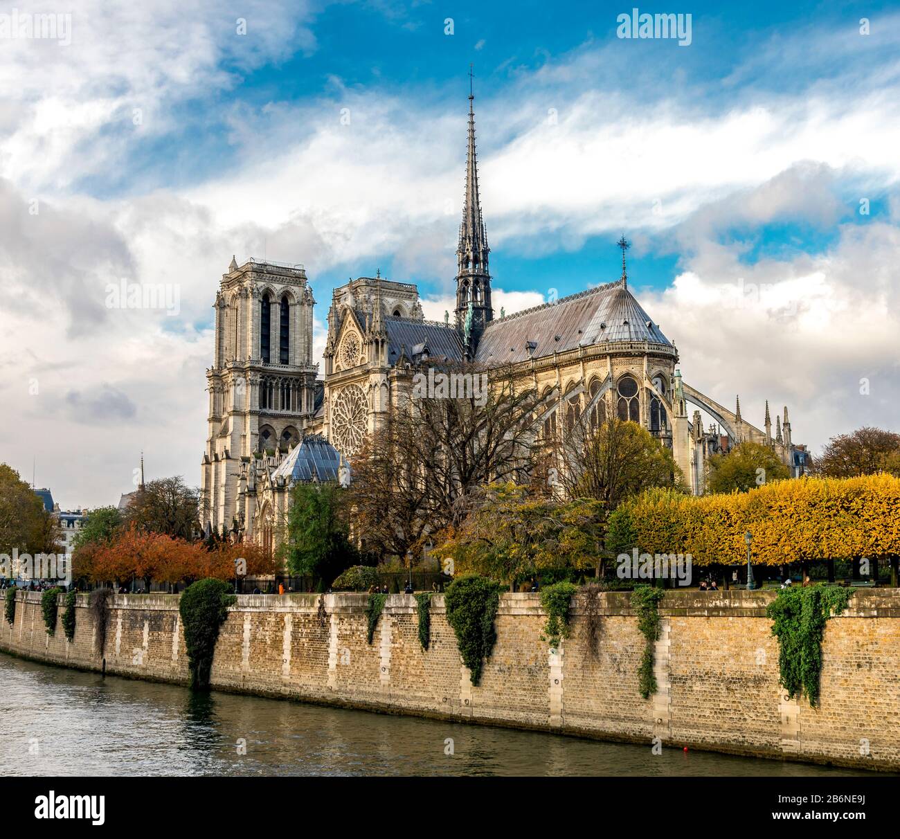 Beautiful Notre-Dame de Paris cathedral with a Gothic spire several month before the fire in colorful autumn season, Paris, France Stock Photo
