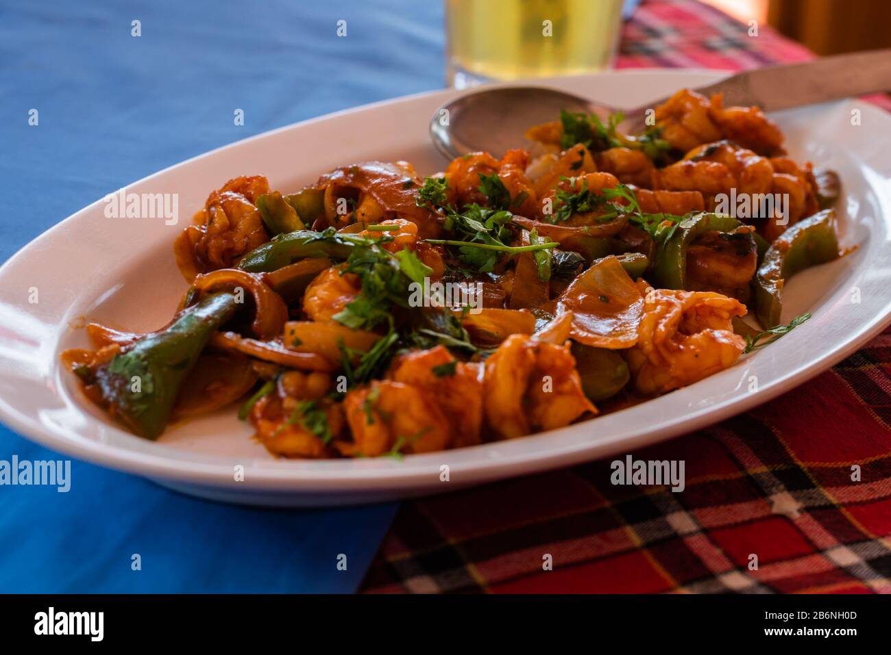 Indian chinese Prawn/Shrimp chilly fry plated and served on a table Stock Photo