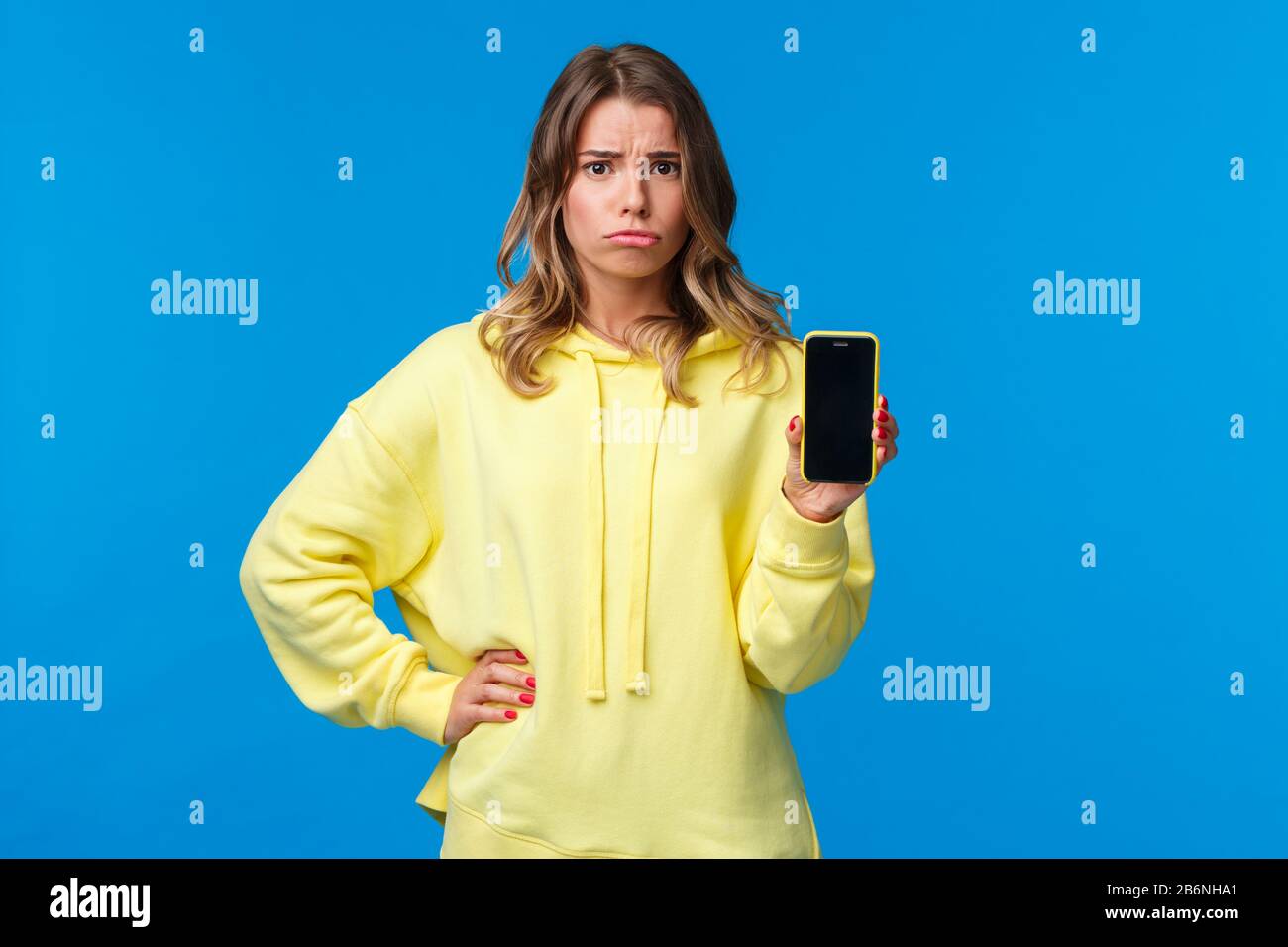 Upset gloomy cute girl broke her phone, feeling sad pouting and looking ...