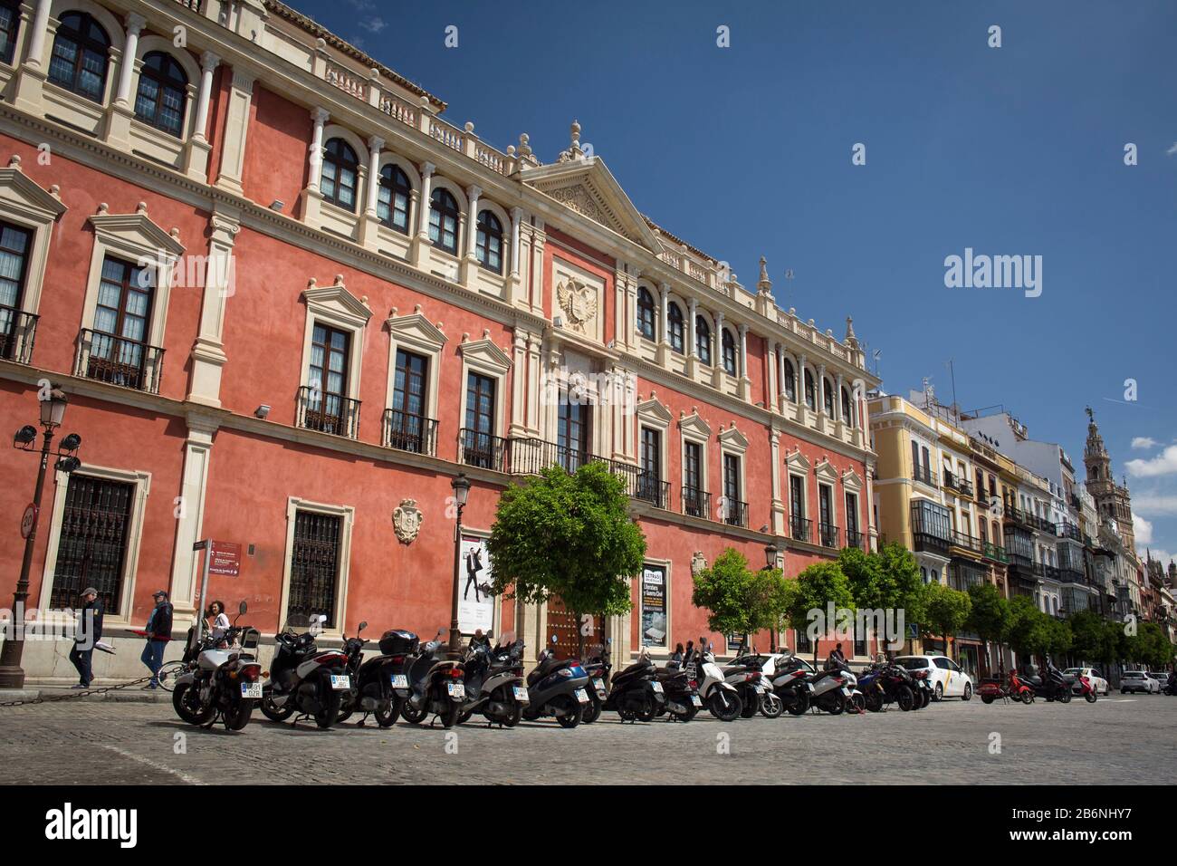 Motorbikes parked next to the Cajasol Foundation Headquarters, former Audience building, at San Francisco Square, Seville, Spain Stock Photo