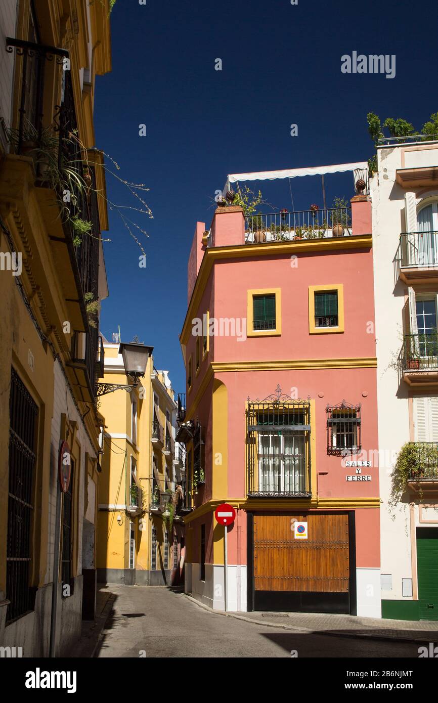 Colorful vertical shot of the corner of Sales y Ferre St with Boteros St, Seville, Spain Stock Photo