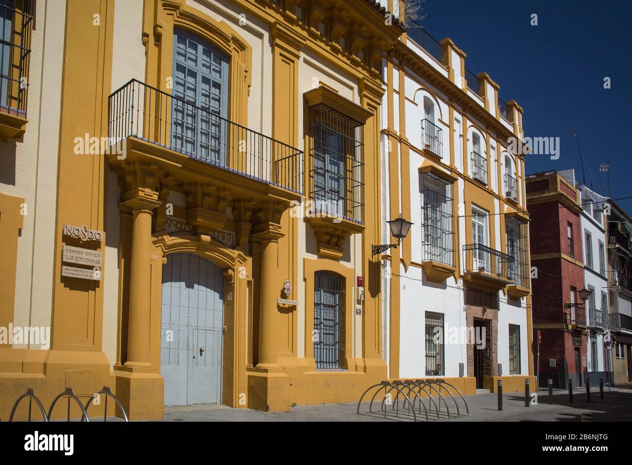 Colorful horizontal shot of Las Columnas Civic Center, former Mareantes University, at La Pureza St, Triana District, Seville, Spain Stock Photo
