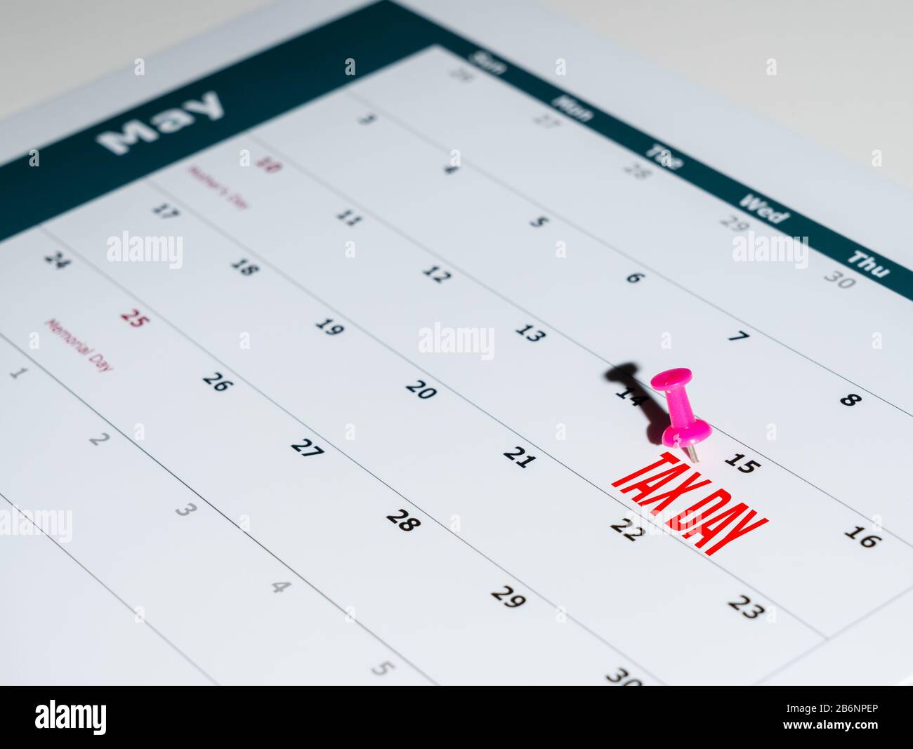 Reminder for sending income tax return for May 15 2020 tax day due to Covid-19 virus delay using calendar page and pin Stock Photo
