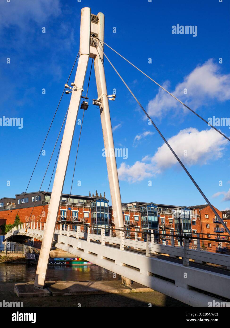 Centenery Bridge a modern pedestrian bridge over the River Aire in Leeds West Yorkshire England Stock Photo