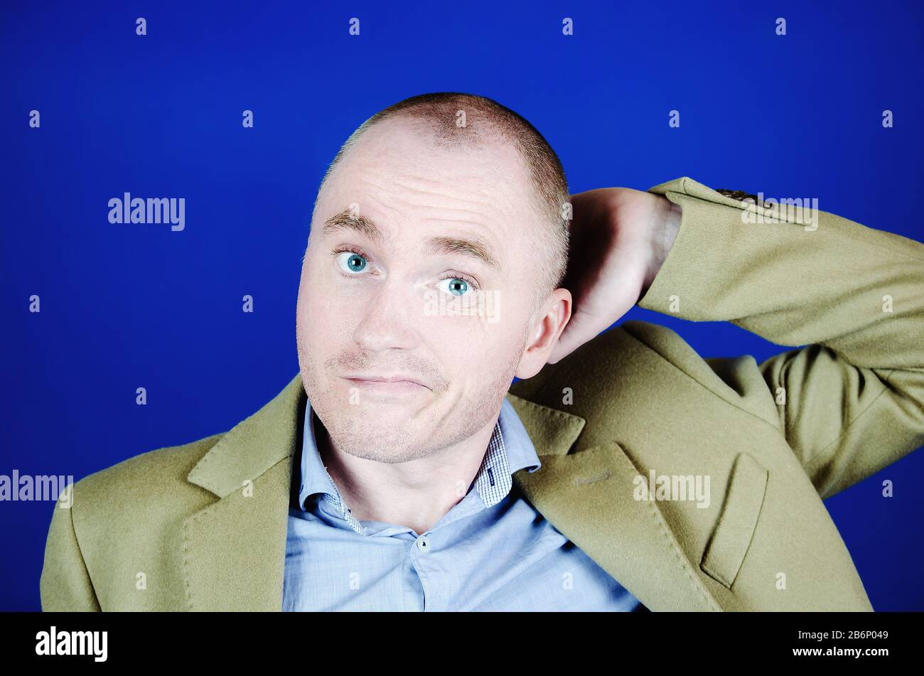 Portrait of confused or surprised white bald man scratch his head. Emotions concept Stock Photo